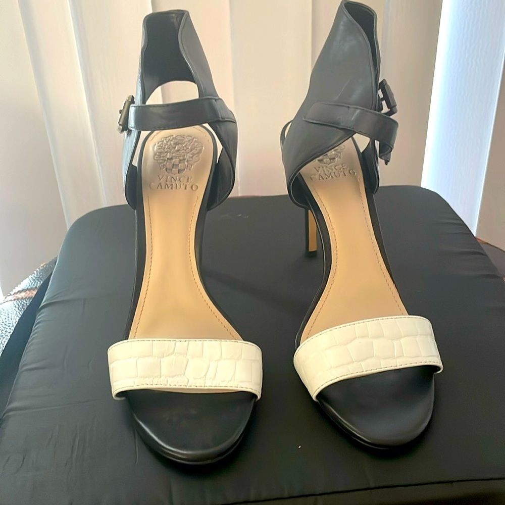 Black and white high heel sandals.